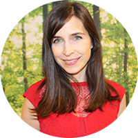 Business woman with brown hair wearing a red blouse