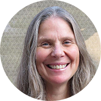 Older woman with gray hair smiling
