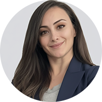 Business woman wearing a dark grey and a light grey shirt under it