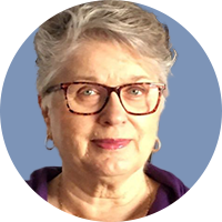 Older white woman with glasses and short hair