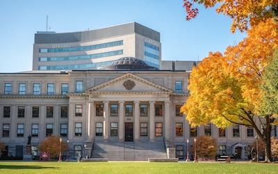 Photo of Tabaret during the fall and the desmarais building in the background