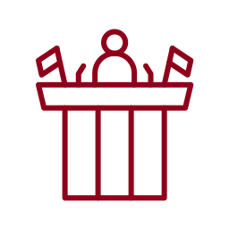 garnet icon of a man on a podium giving a speech