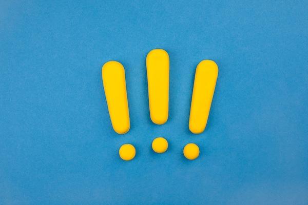 image of three big yellow exclamation marks on top of a blue background