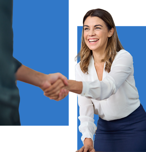 Photo of a white business woman extending her hand for a handshake with an individual