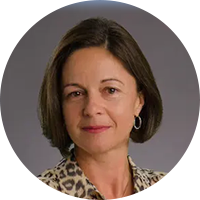 Photo of a white business woman wearing a leopard print button up