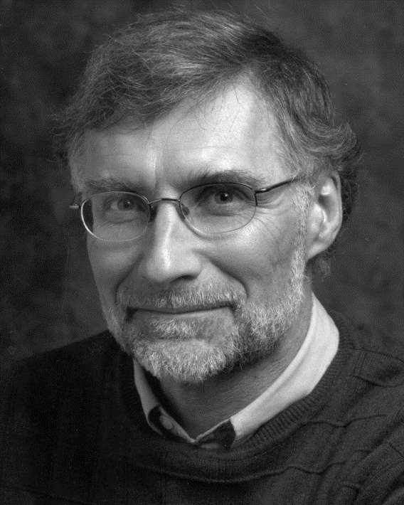 Black and white photo of a older white man in glasses
