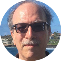 Photo of an older white man wearing sunglasses