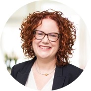 Business woman with glasses and red hair